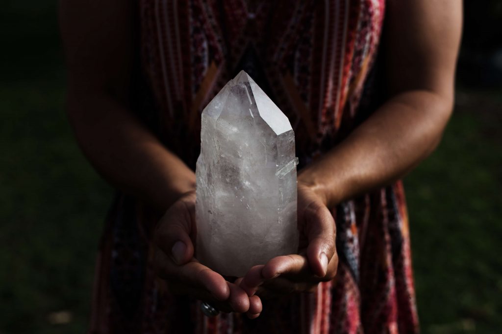 Crystal Healing Holding Quartz Crystal